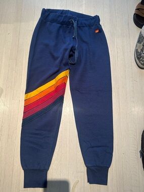 Aviator Nation Navy Track Joggers with Yellow Orange Red Stripe